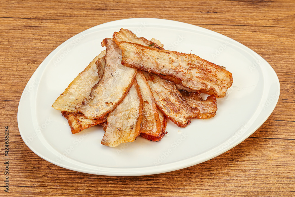 Roasted juicy bacon in the plate Roasted juicy bacon in the plate
