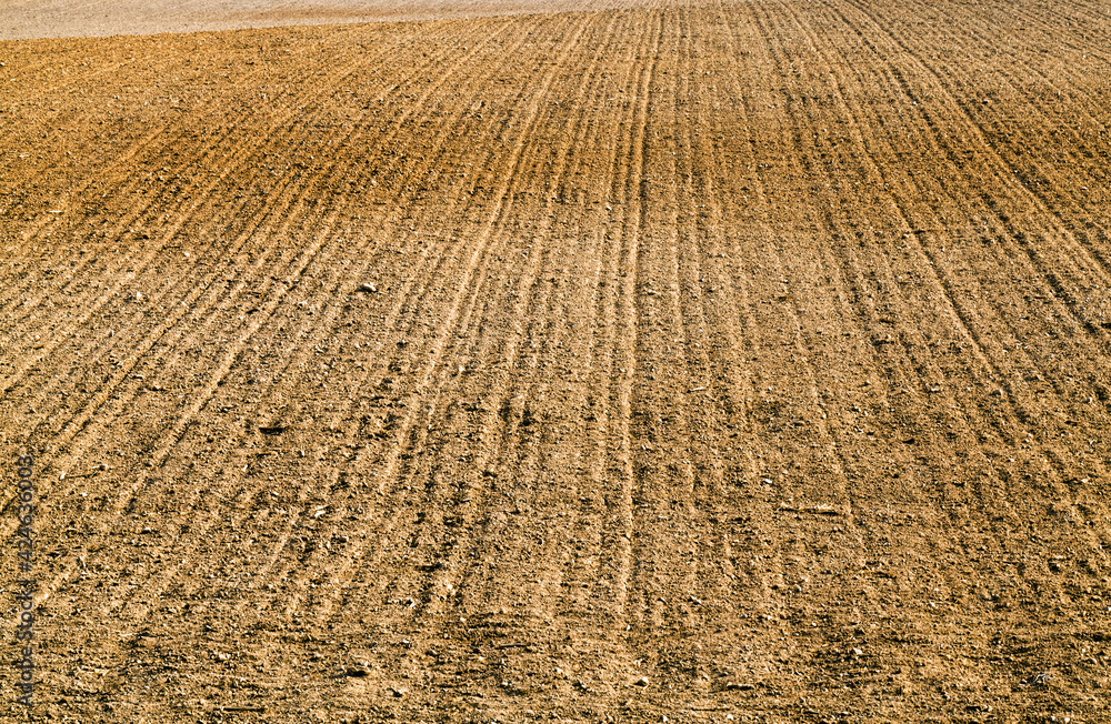 plowed fertile soil is an agricultural field plowed fertile soil is an agricultural field