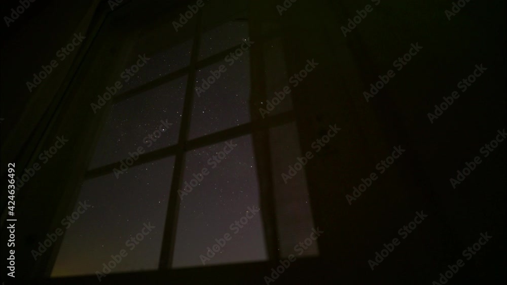 Majestic night sky timelapse through home window in slider movement Majestic night sky timelapse through home window in slider movement