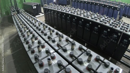 Rows of industrial storage batteries.A room used for backup or uninterruptible power supply.