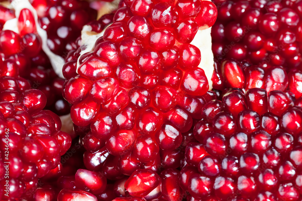 red and ripe fruit pomegranate with red grains red and ripe fruit pomegranate with red grains