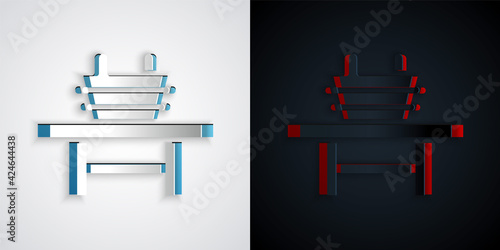 Paper cut Sauna bench with bucket icon isolated on grey and black background. Paper art style. Vector