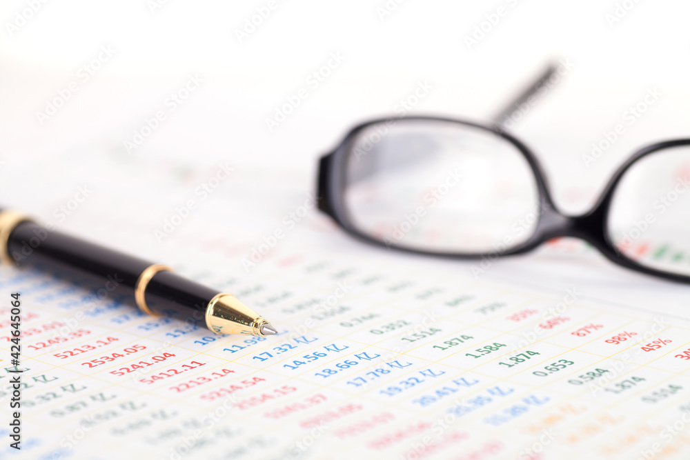 Financial charts and ballpoint pens Financial charts and ballpoint pens