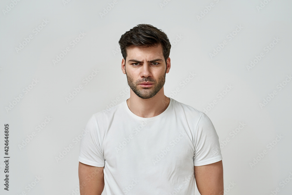 Portrait of frowning angry bearded man Portrait of frowning angry bearded man