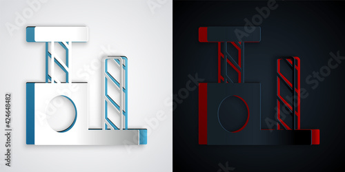 Paper cut Cat scratching post with toy icon isolated on grey and black background. Paper art style. Vector