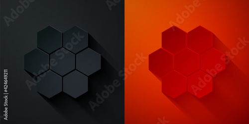Paper cut Honeycomb icon isolated on black and red background. Honey cells symbol. Sweet natural food. Paper art style. Vector