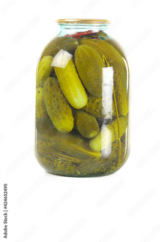 Pickled cucumbers in a glass jar. isolated on white Pickled cucumbers in a glass jar. isolated on white