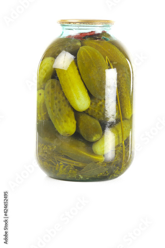 Pickled cucumbers in a glass jar. isolated on white