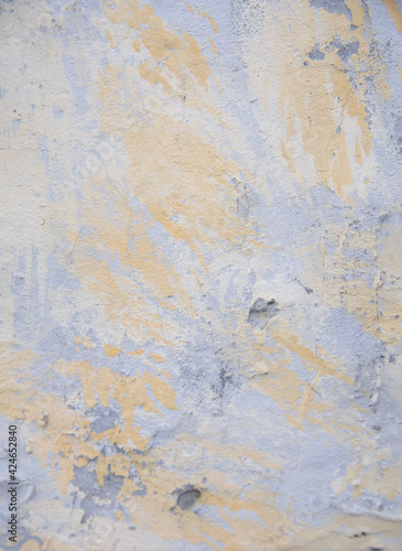 Old yellow gray surface. Cement wall with coarse texture. Decorative vintage background. © Джамиля Ашумова