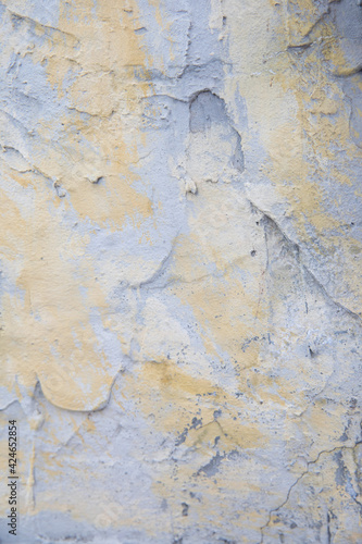 Old yellow gray surface. Cement wall with coarse texture. Decorative vintage background.