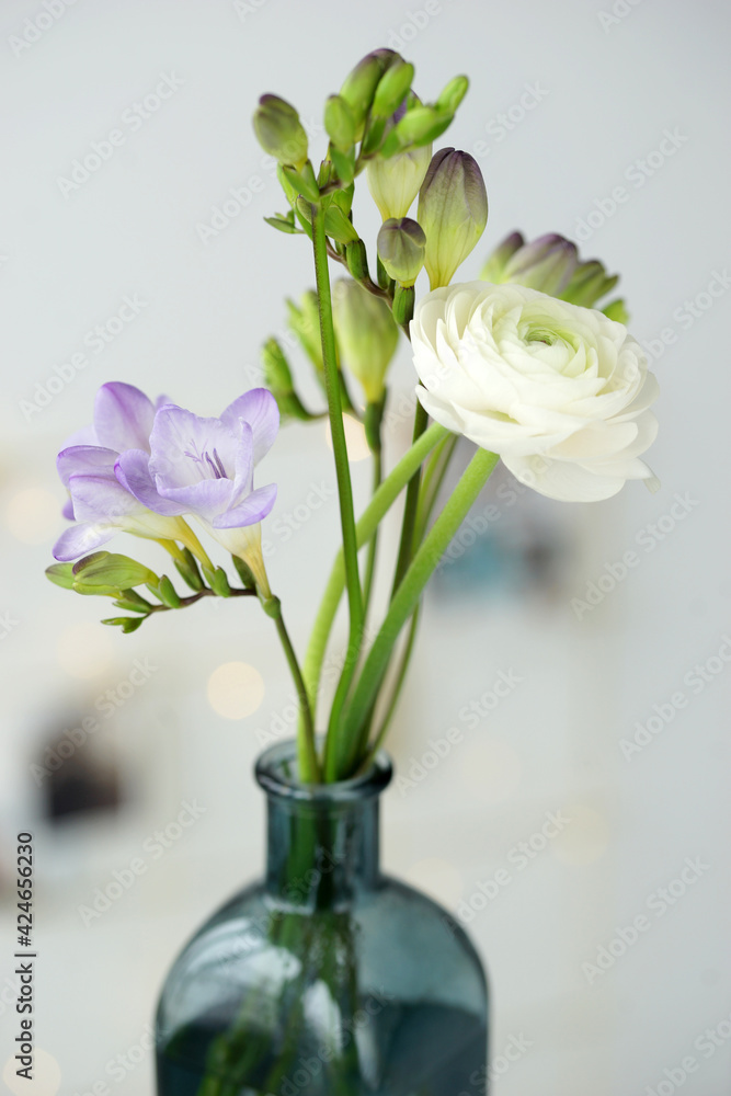 Beautiful bouquet with spring ranunculus and freesias Beautiful bouquet with spring ranunculus and freesias