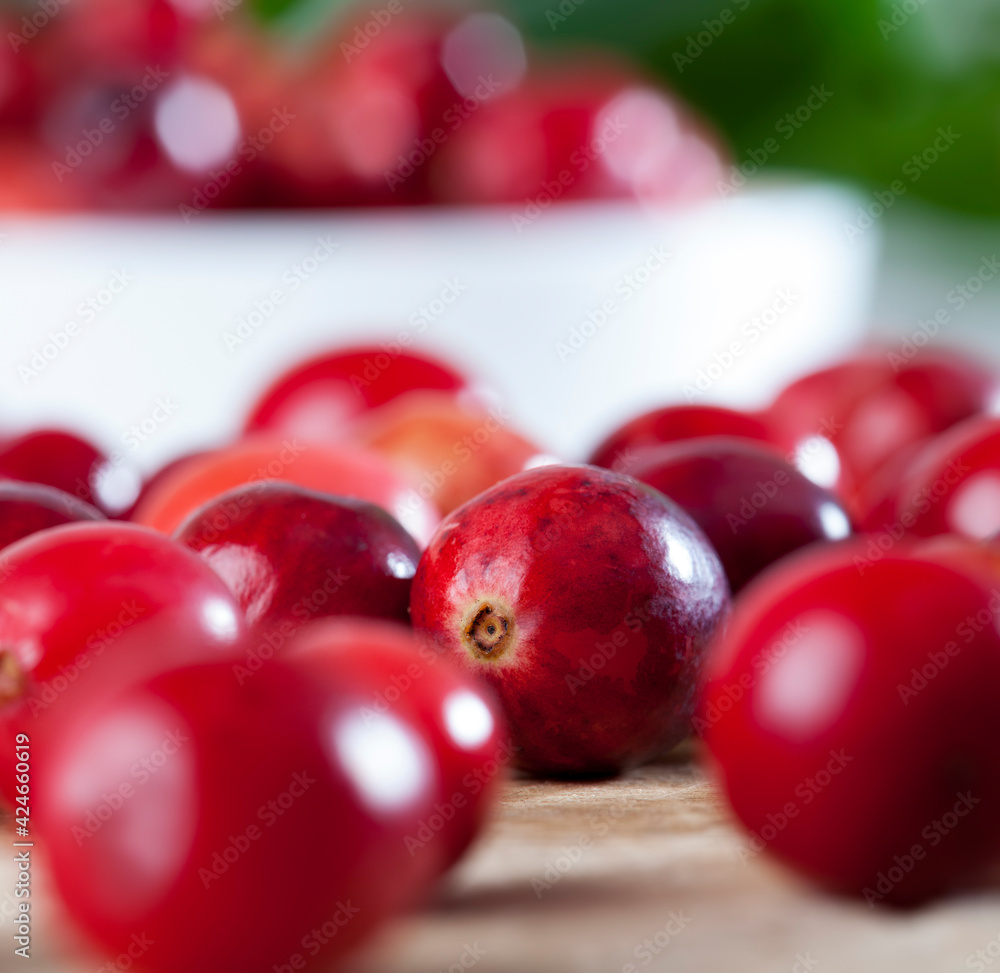 red ripe divided cranberries on the table, homemade cranberries red ripe divided cranberries on the table, homemade cranberries