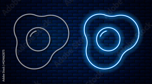 Glowing neon line Scrambled eggs icon isolated on brick wall background. Home cooked food, fried egg, healthy breakfast, omelet icon. Vector