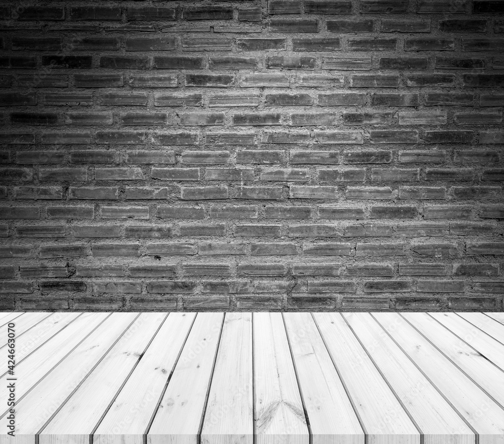 Old wood table with abstract old brick wall with light background for product display Old wood table with abstract old brick wall with light background for product display
