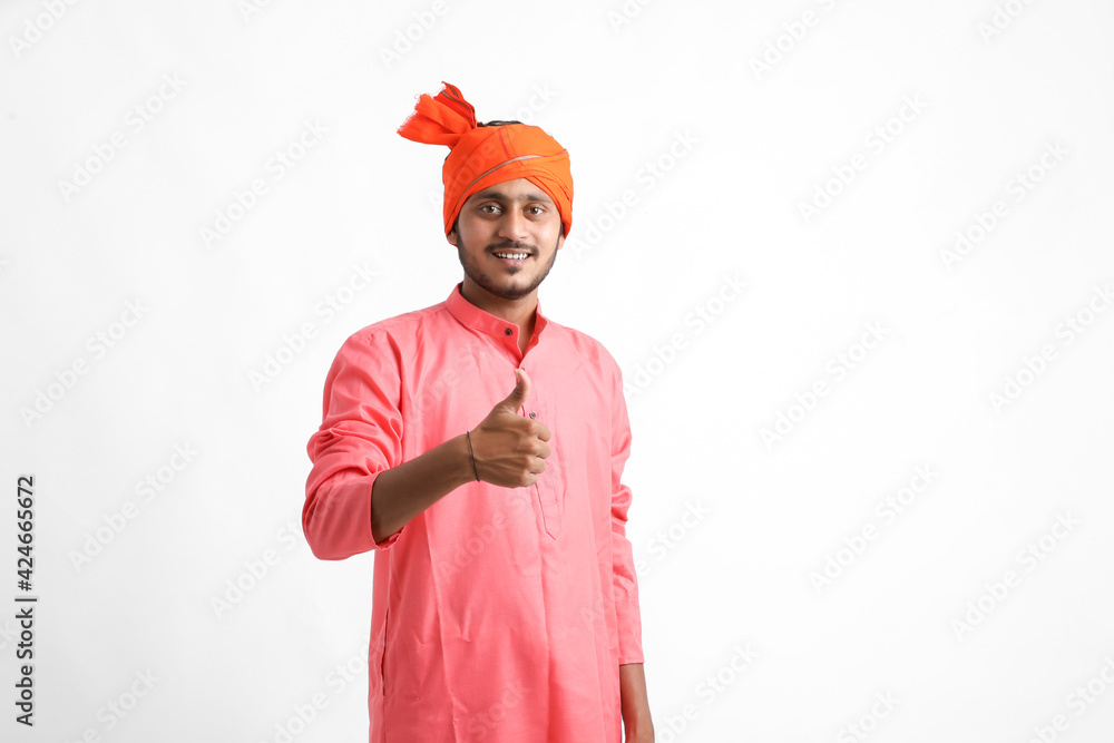 Young indian farmer Showing thumps up on white background Young indian farmer Showing thumps up on white background