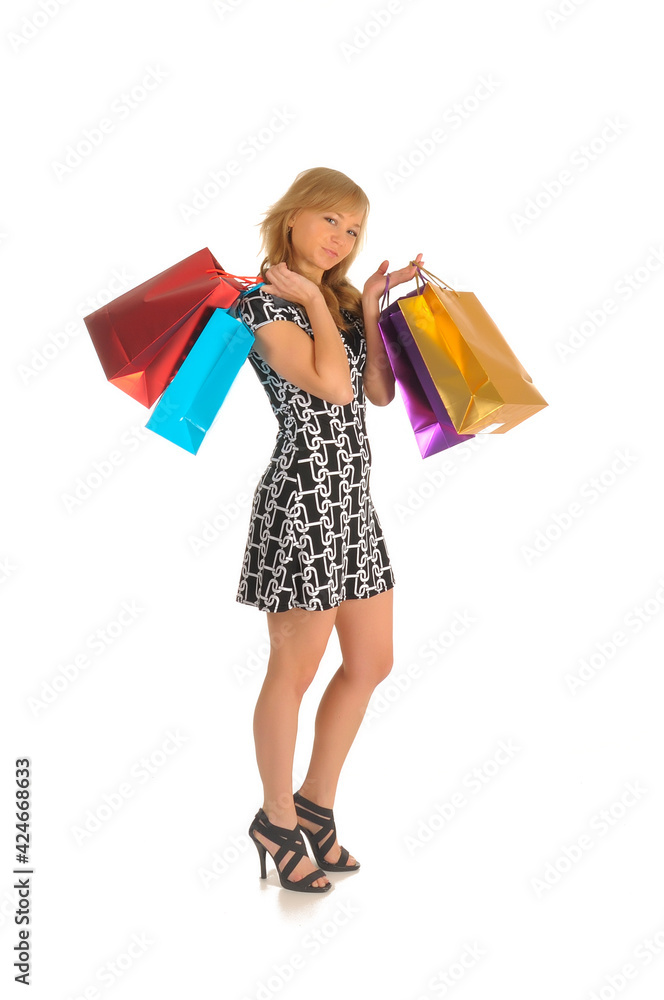 Beautiful woman with a lot of shopping bags. isolated on white Beautiful woman with a lot of shopping bags. isolated on white