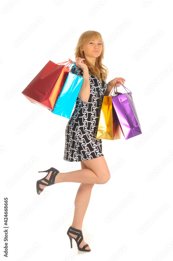 Beautiful woman with a lot of shopping bags. isolated on white Beautiful woman with a lot of shopping bags. isolated on white