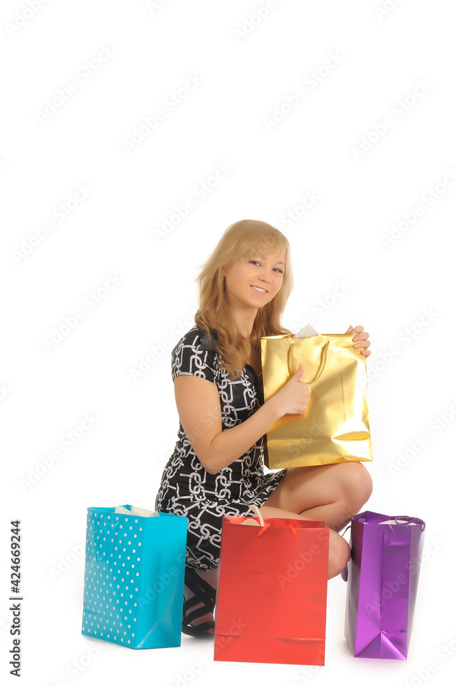 Beautiful woman with a lot of shopping bags. isolated on white Beautiful woman with a lot of shopping bags. isolated on white