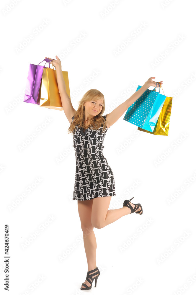 Beautiful woman with a lot of shopping bags. isolated on white Beautiful woman with a lot of shopping bags. isolated on white
