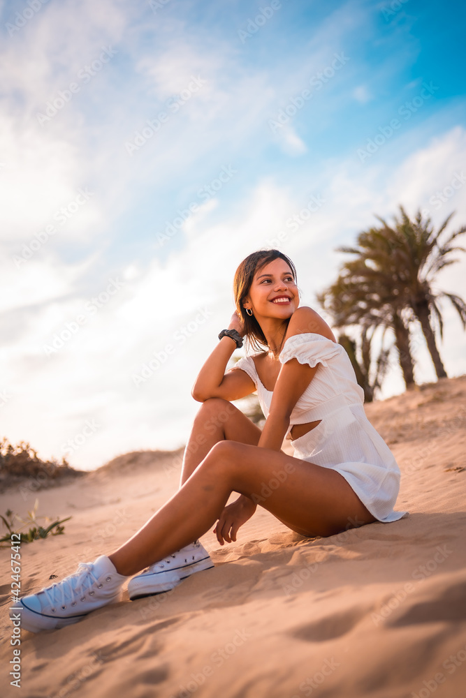 Lifestyle of a young brunette Caucasian woman enjoying vacation on the beach in summer Lifestyle of a young brunette Caucasian woman enjoying vacation on the beach in summer