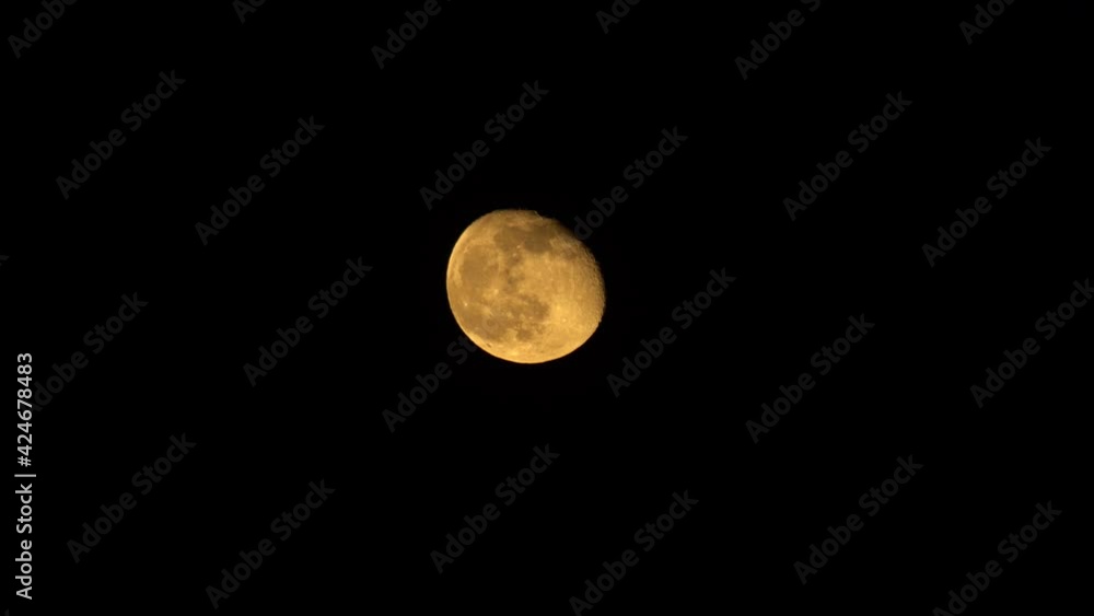 Static shot of third-quarter moon shining in black sky Static shot of third-quarter moon shining in black sky