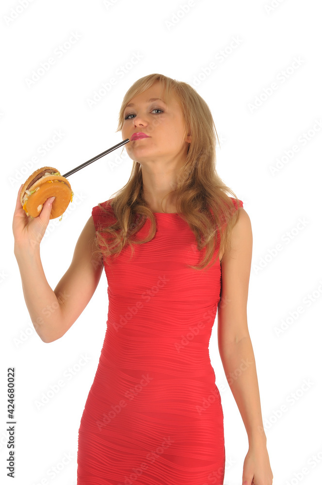 Young beautiful woman with some shopping bags and hamburger isolated on white Young beautiful woman with some shopping bags and hamburger isolated on white