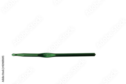 6,5 mm metallic green crochet hook isolated on white background. Tool for crocheting, handmade hobbies, handwork, craft, leisure