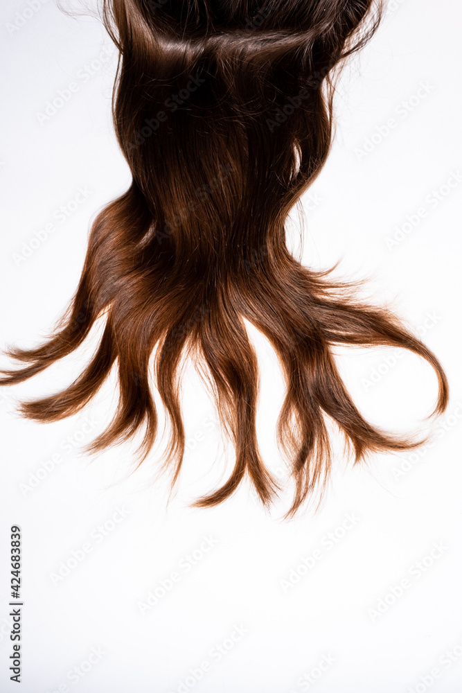 Hair waves curls lie on a white background