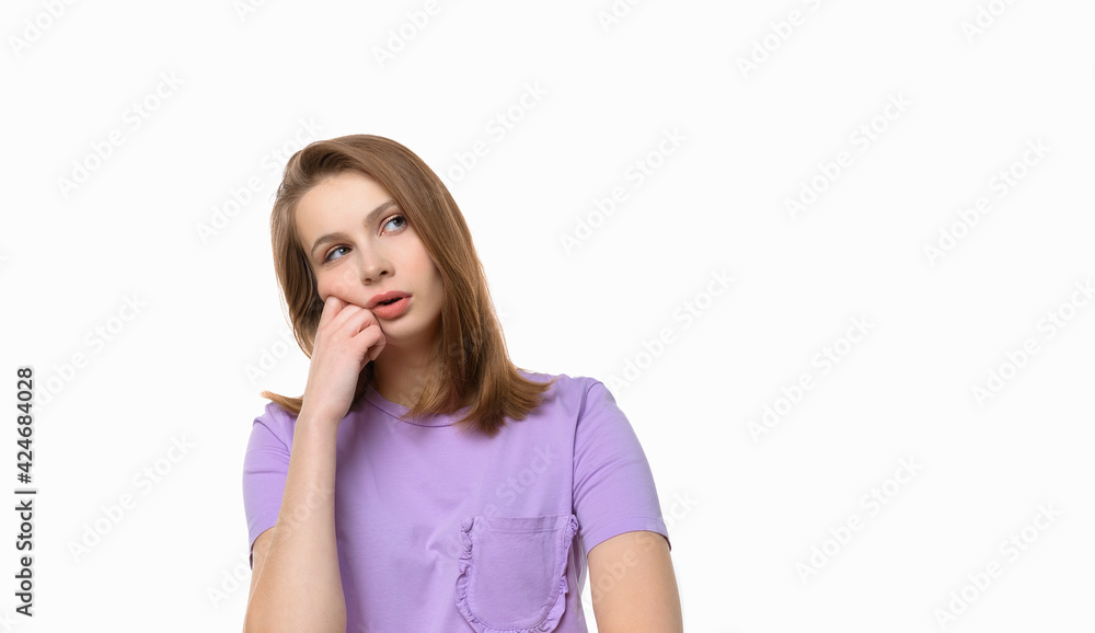Young beautiful woman looking sad and bored holding hand under chin, got tired at university Young beautiful woman looking sad and bored holding hand under chin, got tired at university