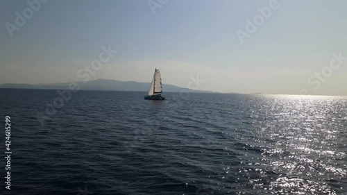 4K Aerial Video Of Sailing Catamaran Moving Under Sail  photo