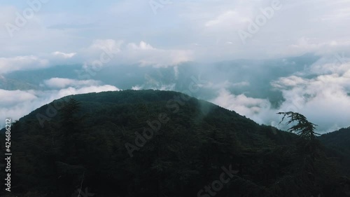 Beautiful landscape of green mountains and sky with clouds. photo