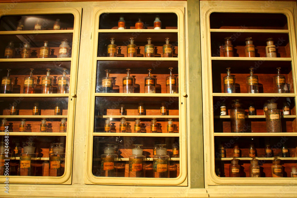 Antique pharmacy antidotes on a shelf