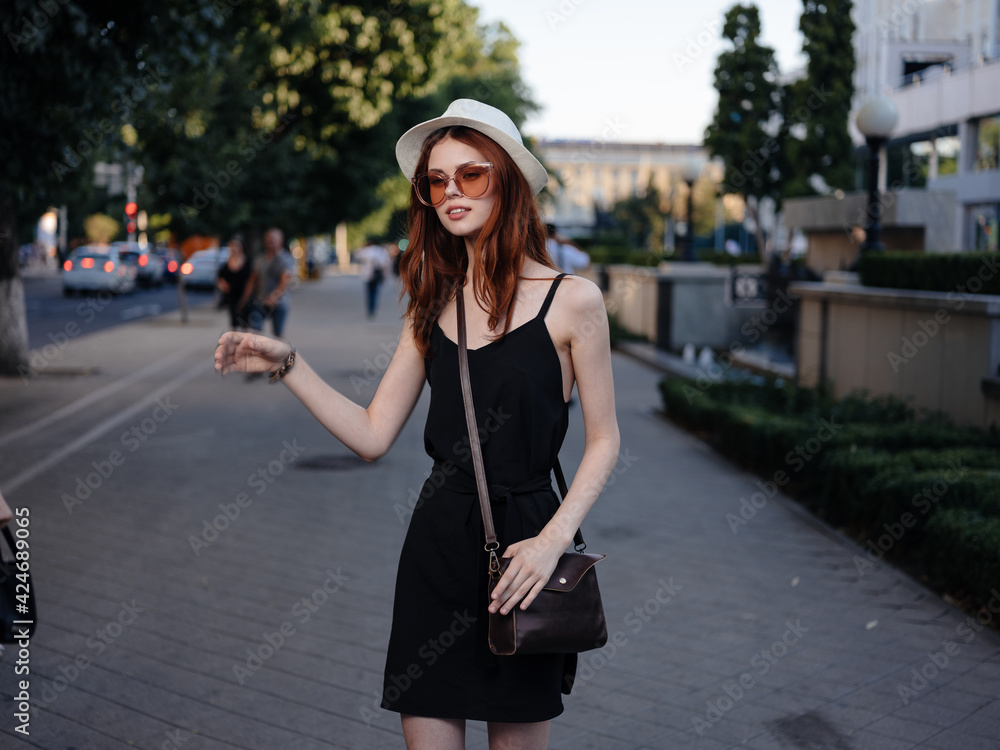 Fashionable Woman in Black Dress and Glasses Bag on Shoulder Nature Park Fashionable Woman in Black Dress and Glasses Bag on Shoulder Nature Park