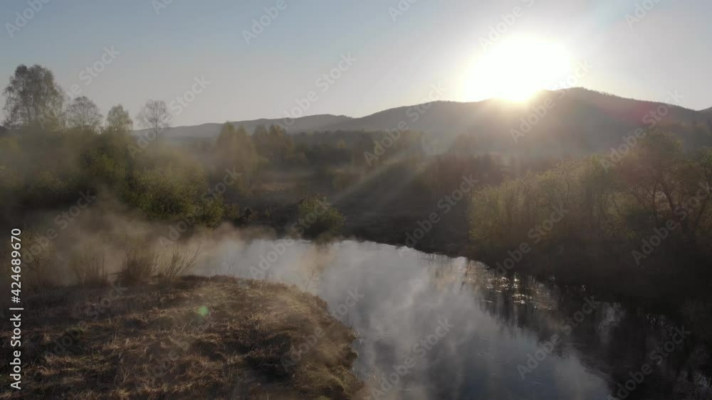 Fog morning over the plain and river floodplain of the meadow near a rural village with a house, aerial view landscape. Fog morning over the plain and river floodplain of the meadow near a rural village with a house, aerial view landscape.