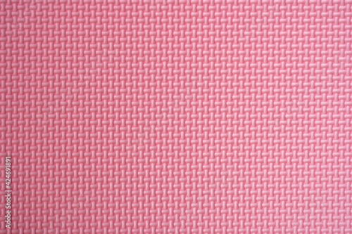 Light pink surface texture of floor mat