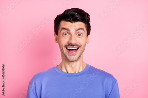 Photo of shocked satisfied man open mouth smile look camera cant believe isolated on pink color background