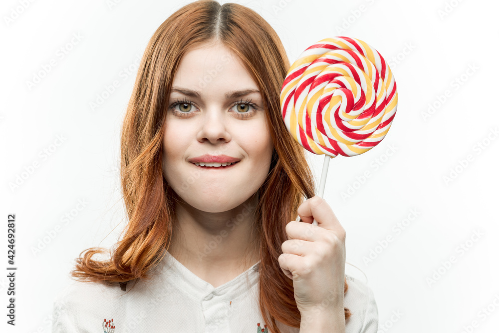 joyful woman with red hair lollipop sweets enjoyment