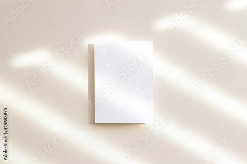 5x7 white card mockup with shadow on beige background
