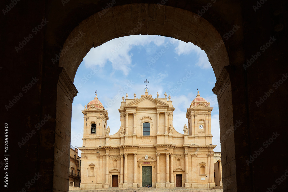 The Cathedral of San Nicolò in Noto is the cathedral of the Diocese of Noto of the ecclesiastical region of Sicily, founded in 1844. View through an archway. 
