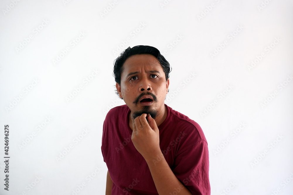 asian man confused face reaction while looking at camera asian man confused face reaction while looking at camera
