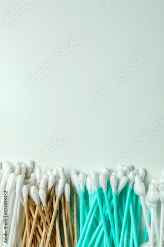 Different cotton swabs on white background, space for text