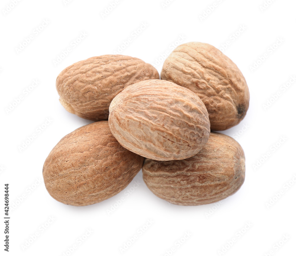 Heap of nutmeg seeds isolated on white, top view Heap of nutmeg seeds isolated on white, top view