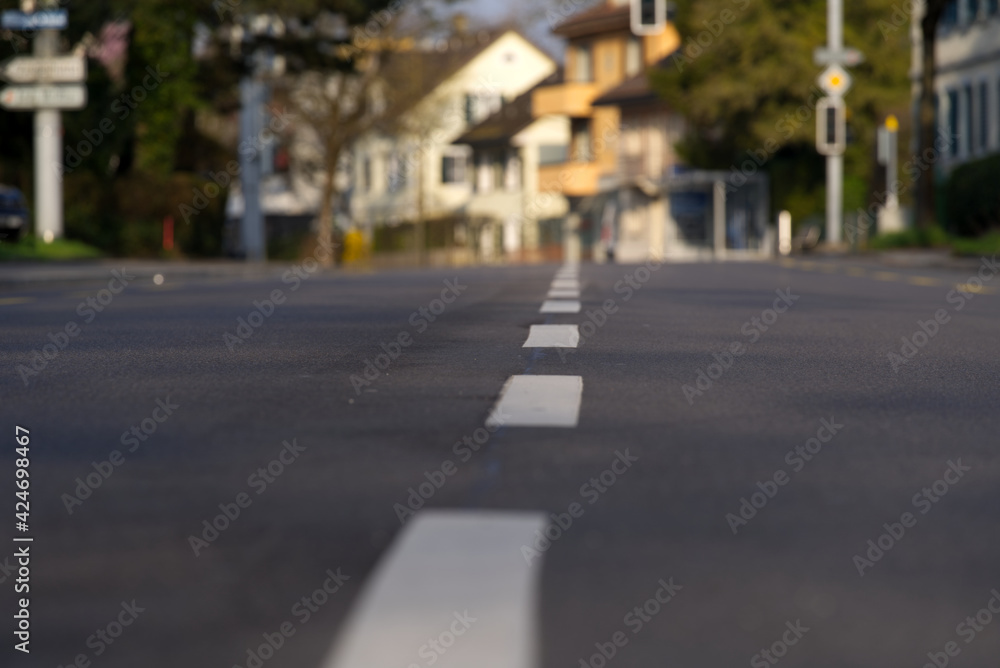 Empty road at city of Zurich, early in the morning. Photo taken April 2nd, 2021, Zurich, Switzerland. Empty road at city of Zurich, early in the morning. Photo taken April 2nd, 2021, Zurich, Switzerland.