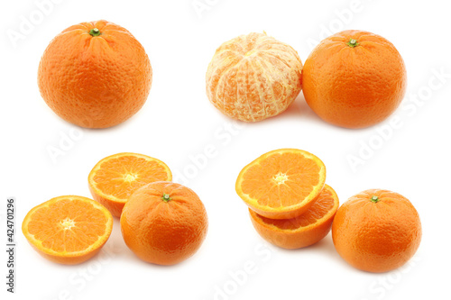 fresh tangerine and some cut ones on a white background