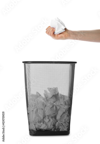 Woman holding crumpled sheets of paper over trash bin, collage