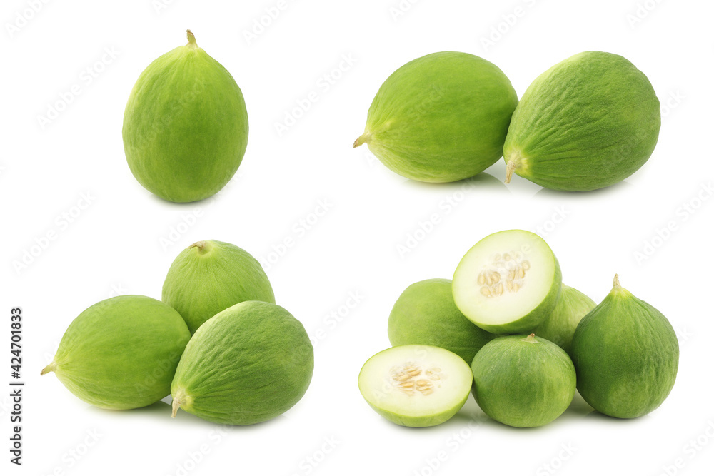 Fresh cumelo's (mix between a cucumber and a melon) on a white background Fresh cumelo's (mix between a cucumber and a melon) on a white background