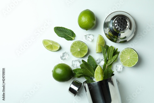 Cocktail shaker and ingredients for mojito on white background