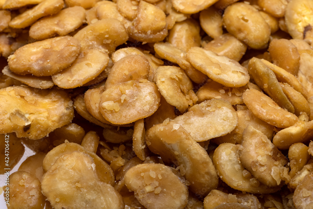 Roasted and salted fava beans for a healthy vegan and vegetarian diet snack. High in protein, vitamins, dietary fibre and nutrients Roasted and salted fava beans for a healthy vegan and vegetarian diet snack. High in protein, vitamins, dietary fibre and nutrients