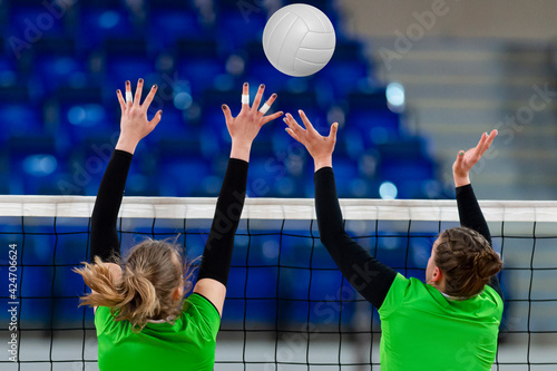 Volleyball game sport with group of girls indoor. Professional sport concept