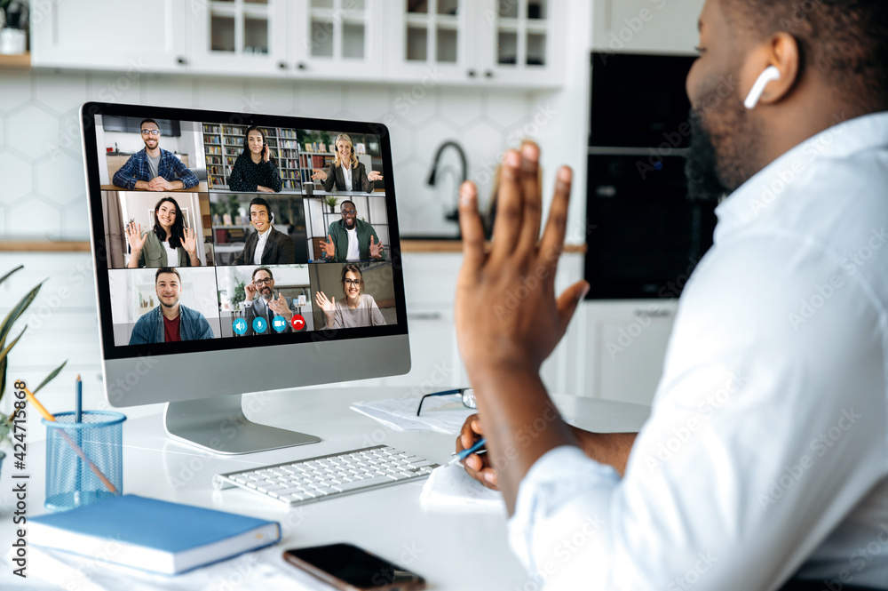 Video call online conference Over shoulder view of african  